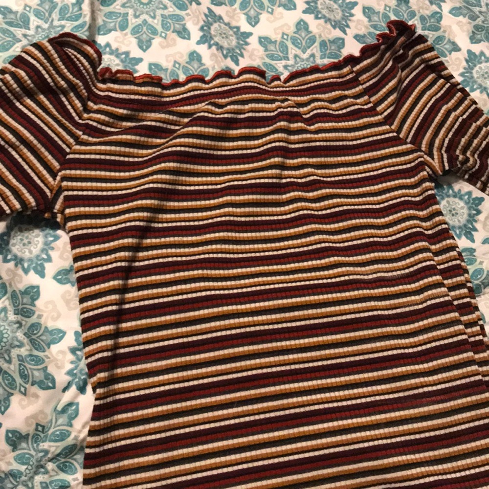 A long sleeve off the shoulder shirt
